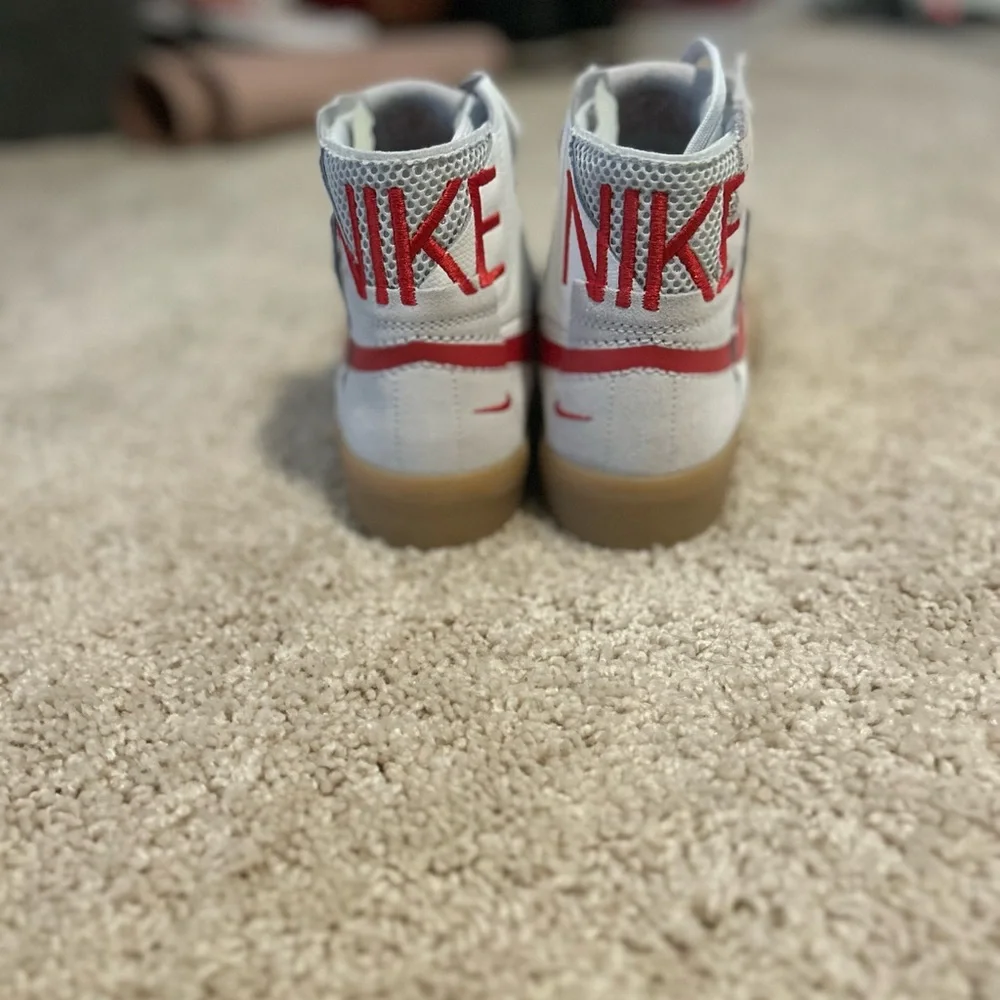 Nike High-Top Sneakers with Red Swoosh